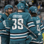 
              San Jose Sharks center Logan Couture, middle, is congratulated by defenseman Mario Ferraro, left, and left wing Alexander Barabanov after scoring against the Seattle Kraken during the second period of an NHL hockey game in San Jose, Calif., Monday, Feb. 20, 2023. (AP Photo/Jeff Chiu)
            