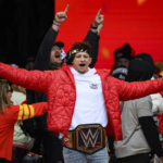 
              File - Kansas City Chiefs Patrick Mahomes, wearing a WWE belt, celebrates the team's Super Bowl victory at a gathering in Kansas City, Mo., Wednesday, Feb. 15, 2023. After the Super Bowl Mahomes posted a photo of himself on Twitter holding the Vince Lombardi trophy in one hand and a WWE belt in the other. (AP Photo/Reed Hoffmann, File)
            