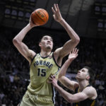 
              Purdue center Zach Edey (15) shoots over Iowa forward Filip Rebraca (0) during the second half of an NCAA college basketball game in West Lafayette, Ind., Thursday, Feb. 9, 2023. Purdue defeated Iowa. (AP Photo/Michael Conroy)
            