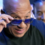 
              Vin Diesel, a cast member in the upcoming film "Fast X," peers over his sunglasses at photographers at the trailer launch for the film, Thursday, Feb. 9, 2023, at L.A. Live in Los Angeles. (AP Photo/Chris Pizzello)
            