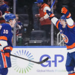 
              New York Islanders' Bo Horvat, right, celebrates with Simon Holmstrom after Holmstrom scored a goal during the third period of an NHL hockey game against the Winnipeg Jets Wednesday, Feb. 22, 2023, in Elmont, N.Y. The Islanders won 2-1. (AP Photo/Frank Franklin II)
            