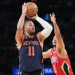 
              New York Knicks guard Jalen Brunson (11) shoots a 3-point basket past New Orleans Pelicans guard CJ McCollum (3) during the first half of an NBA basketball game, Saturday, Feb. 25, 2023, at Madison Square Garden in New York. (AP Photo/Mary Altaffer)
            
