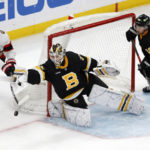
              Boston Bruins' Linus Ullmark (35) blocks a shot by Ottawa Senators' Drake Batherson (19) during the third period of an NHL hockey game, Monday, Feb. 20, 2023, in Boston. (AP Photo/Michael Dwyer)
            