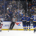 
              St. Louis Blues' Pavel Buchnevich, nearest the official, celebrates with teammates after scoring a goal against the New Jersey Devils during the first period of an NHL hockey game Thursday, Feb. 16, 2023, in St. Louis. (AP Photo/Scott Kane)
            