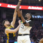 
              Minnesota Timberwolves center Naz Reid (11) shoots against Golden State Warriors guard Ty Jerome during the first half of an NBA basketball game in San Francisco, Sunday, Feb. 26, 2023. (AP Photo/Jeff Chiu)
            