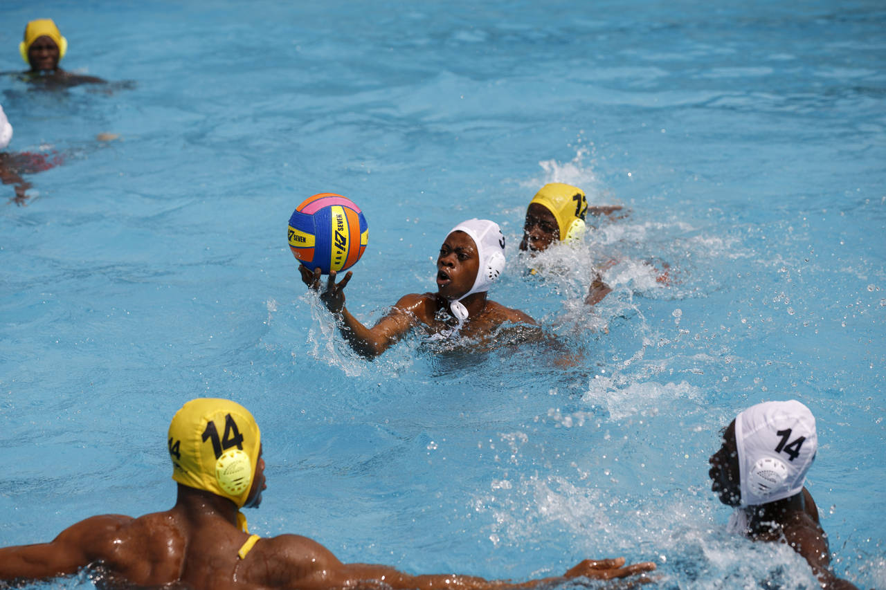 Youth team players warm-up ahead of the Black star water polo competition held at the University of...