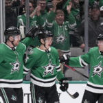 
              Dallas Stars' Jani Hakanpää (2), Nils Lundkvist (5) and Ryan Suter (20) celebrate after Lundkvist scored in the first period of an NHL hockey game against the Anaheim Ducks, Monday, Feb. 6, 2023, in Dallas. (AP Photo/Tony Gutierrez)
            