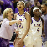 
              FILE -  LSU head coach Kim Mulkey talks with forward Angel Reese (10) during the second half of an NCAA college basketball game against Georgia in Baton Rouge, La., on Feb. 2, 2023. One thing's nearly certain when LSU's Angel Reese and South Carolina's Aliyah Boston face off Sunday in a showdown of the country's last two undefeated teams: Someone, if not both, will come away with a double-double. (AP Photo/Derick Hingle, File)
            
