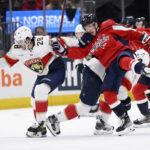 
              Florida Panthers defenseman Josh Mahura (28) and Washington Capitals center Joe Snively, right, compete for the puck during the first period of an NHL hockey game Thursday, Feb. 16, 2023, in Washington. (AP Photo/Nick Wass)
            