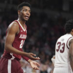 
              Alabama forward Brandon Miller reacts to an official's call during overtime in the team's NCAA college basketball game against South Carolina on Wednesday, Feb. 22, 2022, in Columbia, S.C. Alabama won 78-76. (AP Photo/Sean Rayford)
            