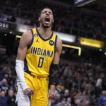 
              Indiana Pacers' Tyrese Haliburton reacts after a dunk during the second half of an NBA basketball game against the Sacramento Kings, Friday, Feb. 3, 2023, in Indianapolis. (AP Photo/Darron Cummings)
            