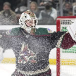 
              Arizona Coyotes goaltender Connor Ingram makes a glove save during the second period of an NHL hockey game against the Los Angeles Kings Saturday, Feb. 18, 2023, in Los Angeles. (AP Photo/Mark J. Terrill)
            