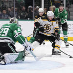 
              Dallas Stars goaltender Jake Oettinger (29) defends as Boston Bruins left wing Brad Marchand (63) attempts to take a shot in the second period of an NHL hockey game, Tuesday, Feb. 14, 2023, in Dallas. (AP Photo/Tony Gutierrez)
            
