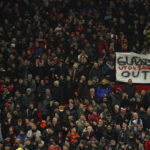 
              An anti-Glazer family banner is held up by members of the crowd before the English League Cup semifinal second leg soccer match between Manchester United and Nottingham Forest at Old Trafford in Manchester, England, Wednesday, Feb. 1, 2023. The Glazer family are the owners of Manchester United. (AP Photo/Dave Thompson)
            