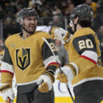 
              Vegas Golden Knights center Chandler Stephenson, right, celebrates after left wing William Carrier, left, scored against the San Jose Sharks during the third period of an NHL hockey game Thursday, Feb. 16, 2023, in Las Vegas. (AP Photo/John Locher)
            