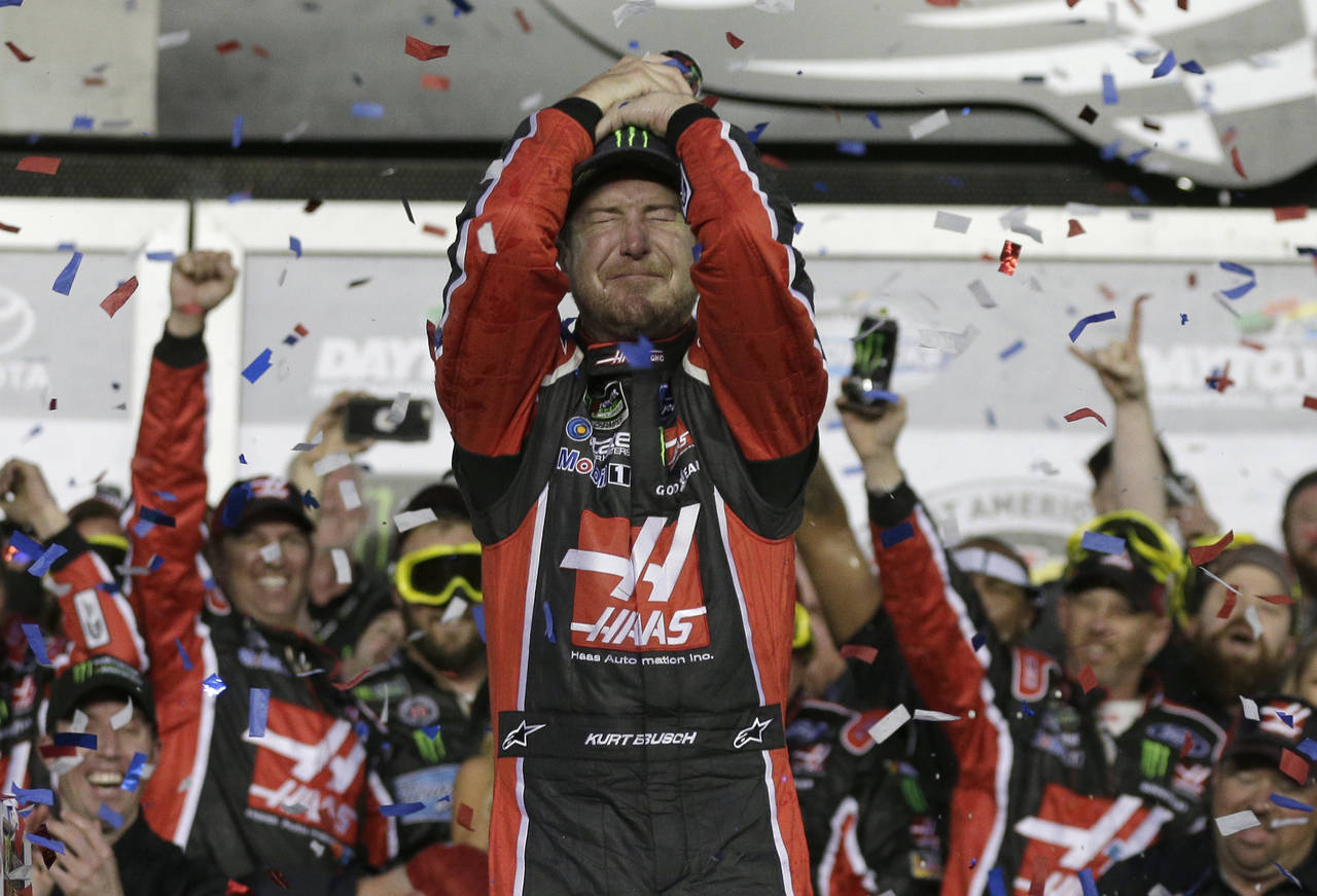 FILE - Kurt Busch celebrates in Victory Lane after winning the NASCAR Daytona 500 auto race at Dayt...