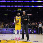 
              Los Angeles Lakers forward LeBron James, left, poses with Kareem Abdul-Jabbar after passing Abdul-Jabbar to become the NBA's all-time leading scorer during the second half of an NBA basketball game against the Oklahoma City Thunder Tuesday, Feb. 7, 2023, in Los Angeles. (AP Photo/Ashley Landis)
            