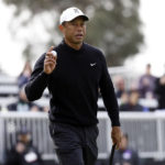 
              Tiger Woods acknowledges the gallery on the 17th green during the second round of the Genesis Invitational golf tournament at Riviera Country Club, Friday, Feb. 17, 2023, in the Pacific Palisades area of Los Angeles. (AP Photo/Ryan Kang)
            