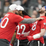 
              AFC tight end Dawson Knox of the Buffalo Bills, right, celebrates a two-point conversion with teammates center Mitch Morse of the Buffalo Bills, left, and running back Derrick Henry (22) of the Tennesse Titans during the flag football event at the NFL Pro Bowl, Sunday, Feb. 5, 2023, in Las Vegas. (AP Photo/John Locher)
            