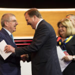 
              FILE - International Olympic Committee, IOC, President Thomas Bach from Germany, shakes hands with Swedish Prime Minister Stefan Lofven during the first day of the 134th Session of the International Olympic Committee (IOC), at the SwissTech Convention Centre, in Lausanne, on June 24, 2019. For an ailing search for a 2030 Olympics host now to have Sweden emerge as frontrunner is a surprise in Stockholm as elsewhere. (Jean-Christophe Bott/Keystone via AP, File)
            