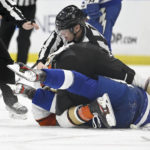 
              Officials work to separate Tampa Bay Lightning center Vladislav Namestnikov, in blue, and Anaheim Ducks left wing Max Jones during the third period of an NHL hockey game Tuesday, Feb. 21, 2023, in Tampa, Fla. (AP Photo/Jason Behnken)
            