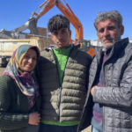 
              Taha Erdem, 17, center, his mother Zeliha Erdem, left, and father Ali Erdem pose for a photograph next to the destroyed building where Tahan was trapped after the earthquake of Feb. 6, in Adiyaman, Turkey, Friday, Feb. 17, 2023. Taha Erdem, a resident of southeastern Turkey's Adiyaman, is one of the hundreds of survivors pulled out of collapsed buildings after the Feb. 6 powerful quake. Erdem, who is 17, filmed himself on his phone while stuck and sandwiched between concrete in what he thought would be his last words. (AP Photo/Mehmet Mucahit Ceylan)
            