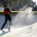 
              Tiger Woods hits from a bunker to the third green during the final round of the Genesis Invitational golf tournament at Riviera Country Club, Sunday, Feb. 19, 2023, in the Pacific Palisades area of Los Angeles. (AP Photo/Ryan Kang)
            