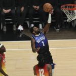 
              Team LeBron guard Kyrie Irving (2) shoots during the second half of the NBA basketball All-Star game Sunday, Feb. 19, 2023, in Salt Lake City. (AP Photo/Rob Gray)
            