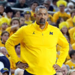 
              Michigan head coach Juwan Howard watches from the sideline during the first half of an NCAA college basketball game against Michigan State, Saturday, Feb. 18, 2023, in Ann Arbor, Mich. (AP Photo/Carlos Osorio)
            