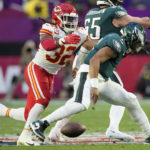 
              Philadelphia Eagles quarterback Jalen Hurts, right, loses a fumble after being hit by Kansas Phjiladelphia Eagles quarterback Jalen Hurts fumbles as he ihit by Kansas City Chiefs linebacker Nick Bolton (32) during the first half of the NFL Super Bowl 57 football game between the Kansas City Chiefs and the Philadelphia Eagles, Sunday, Feb. 12, 2023, in Glendale, Ariz. Bolton picked up the fumble and scored on the play. (AP Photo/Marcio J. Sanchez)
            