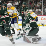 
              Minnesota Wild goaltender Filip Gustavsson (32) watches play during the second period of the team's NHL hockey game against the Nashville Predators on Sunday, Feb. 19, 2023, in St. Paul, Minn. (AP Photo/Abbie Parr)
            
