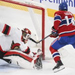 
              Montreal Canadiens' Nick Suzuki scores against Ottawa Senators goaltender Mads Sogaard (40) during the second period of an NHL hockey game Saturday, Feb. 25, 2023, in Montreal. (Graham Hughes/The Canadian Press via AP)
            