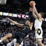 
              Northwestern guard Ty Berry, left, battles for a rebound against Purdue forward Mason Gillis during the second half of an NCAA college basketball game in Evanston, Ill., Sunday, Feb. 12, 2023. (AP Photo/Nam Y. Huh)
            