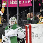 
              Vegas Golden Knights right wing Reilly Smith (19) and right wing Michael Amadio (22) celebrate after Amado's goal against the Dallas Stars during the second period of an NHL hockey game Saturday, Feb. 25, 2023, in Las Vegas. (AP Photo/David Becker)
            