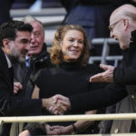 
              Manchester United's Chairman Avie Glazer, right, and Newcastle United's Chairman Yasir Al-Rumayyan, left, shake hands and Newcastle's Club Director Amanda Staveley, centre, smiles before English League Cup final soccer match between Manchester United and Newcastle United at Wembley Stadium in London, Sunday, Feb. 26, 2023. (AP Photo/Alastair Grant)
            
