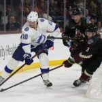 
              Tampa Bay Lightning right wing Corey Perry skates away from Arizona Coyotes defenseman Josh Brown (3) and center Travis Boyd (72) in the second period during an NHL hockey game, Wednesday, Feb. 15, 2023, in Tempe, Ariz. (AP Photo/Rick Scuteri)
            