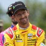 
              FILE - Romain Grosjean looks on before the IndyCar Detroit Grand Prix auto race on Belle Isle in Detroit, June 5, 2022. The IndyCar season begins Sunday, March 5, 2023, with the Grand Prix of St. Petersburg.(AP Photo/Paul Sancya, File)
            