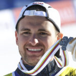 
              Greece's Aj Ginnis shows the silver medal of the men's World Championship slalom, in Courchevel, France, Sunday Feb. 19, 2023. (AP Photo/Marco Trovati)
            
