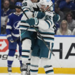 
              San Jose Sharks right wing Timo Meier (28) celebrates with defenseman Erik Karlsson (65) after Meier scored the game-winning goal against the Tampa Bay Lightning during overtime in an NHL hockey game Tuesday, Feb. 7, 2023, in Tampa, Fla. (AP Photo/Chris O'Meara)
            