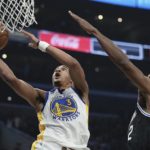 
              Golden State Warriors guard Jordan Poole, left, shoots as Los Angeles Clippers forward Kawhi Leonard defends during the first half of an NBA basketball game Tuesday, Feb. 14, 2023, in Los Angeles. (AP Photo/Mark J. Terrill)
            
