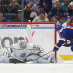 
              Los Angeles Kings goaltender Jonathan Quick (32) makes a save against New York Islanders left wing Matt Martin (17) during the first period of an NHL hockey game Friday, Feb. 24, 2023, in Elmont, N.Y. (AP Photo/Mary Altaffer)
            