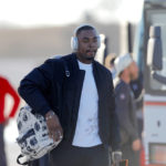 
              Kansas City Chiefs defensive tackle Chris Jones walks to a waiting bus as he and teammates return home a day after winning the NFL Super Bowl 57 football game, Monday, Feb. 13, 2023, in Kansas City, Mo. (AP Photo/Colin E. Braley)
            