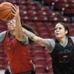 
              UNLV guard Essence Booker, right, tries to steal the ball from center Keyana Wilfred during practice Wednesday, Feb. 15, 2023, in Las Vegas. This season the Lady Rebels are repeat Mountain West champions and ranked at No. 24 in the AP poll for the first time in 29 years.(AP Photo/John Locher)
            