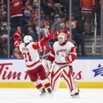 
              Detroit Red Wings' Dylan Larkin (71) and goalie Ville Husso (35) celebrate the team's win over the Edmonton Oilers in an NHL hockey game Wednesday, Feb. 15, 2023, in Edmonton, Alberta. (Jason Franson/The Canadian Press via AP)
            