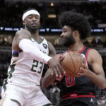 
              Chicago Bulls' Coby White, right, drives to the basket under pressure from Milwaukee Bucks' Wesley Matthews during the first half of an NBA basketball game Thursday, Feb. 16, 2023, in Chicago. (AP Photo/Charles Rex Arbogast)
            