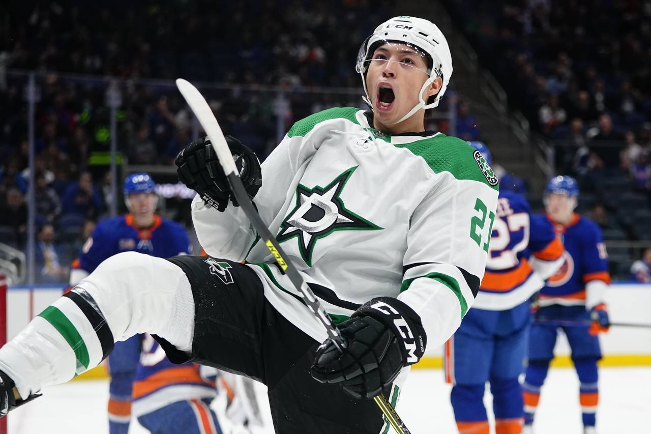 Dallas Stars' Jason Robertson celebrates after scoring a goal during the first period of an NHL hoc...
