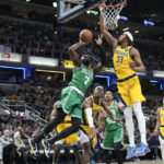 
              Boston Celtics guard Jaylen Brown (7) shoots against Indiana Pacers center Myles Turner (33) during the first half of an NBA basketball game in Indianapolis, Thursday, Feb. 23, 2023. (AP Photo/AJ Mast)
            