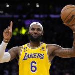 
              Los Angeles Lakers forward LeBron James gestures after passing Kareem Abdul-Jabbar to become the NBA's all-time leading scorer during the second half of an NBA basketball game against the Oklahoma City Thunder Tuesday, Feb. 7, 2023, in Los Angeles. (AP Photo/Ashley Landis)
            