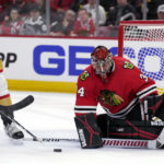 
              Chicago Blackhawks goaltender Petr Mrazek, right, saves a shot by Vegas Golden Knights center Brett Howden during the first period of an NHL hockey game in Chicago, Tuesday, Feb. 21, 2023. (AP Photo/Nam Y. Huh)
            