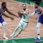 
              Boston Celtics guard Derrick White (9) drives to the basket between Philadelphia 76ers center Joel Embiid (21) and forward Tobias Harris (12) during the first half of an NBA basketball game, Wednesday, Feb. 8, 2023, in Boston. (AP Photo/Charles Krupa)
            